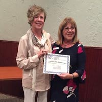 kathy castellano holding plaque